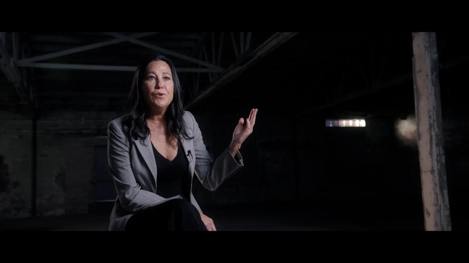 Detective Lexi Taylor speaking during an investigative interview in the horror mockumentary Strange Harvest
