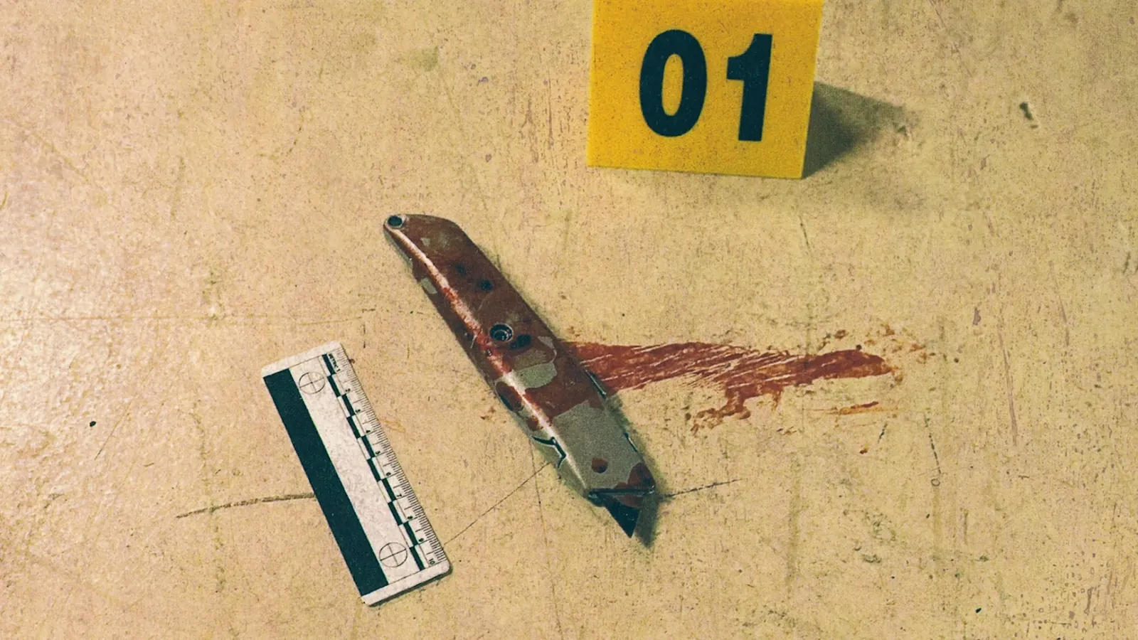 Blood stained knife labeled as forensic evidence during a murder investigation in Strange Harvest